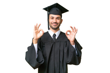 Young university graduate man over isolated background showing an ok sign with fingers