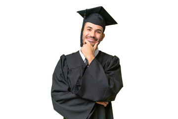 Young university graduate man over isolated background smiling