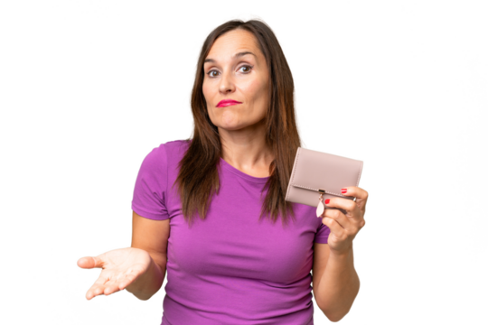 Middle-aged caucasian woman holding a wallet over isolated background making doubts gesture while lifting the shoulders