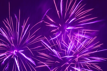 bright purple fireworks in night sky background