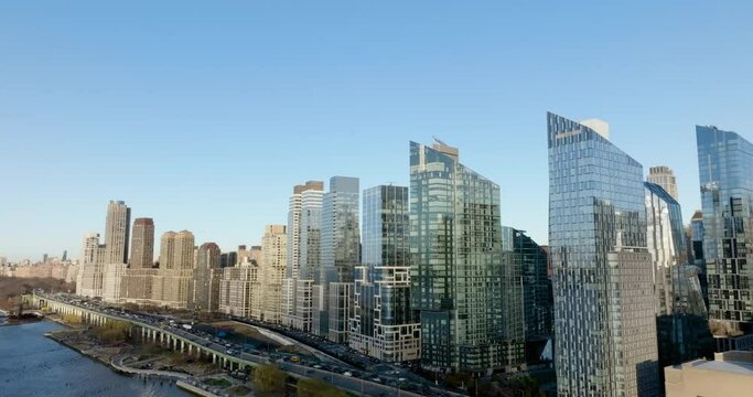 Reflecting apartments on the coastline of Hudson river, spring in Riverside Blvd, New York - Aerial view