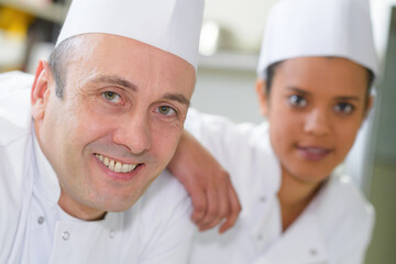 a portrait of chef and trainee