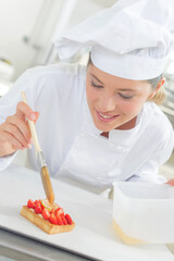 a chef is basting pastry