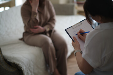 woman finds solace in the confidence and support of her therapist during a counseling session. The...