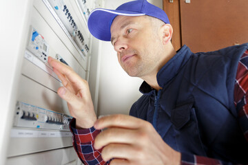 electrician installing energy saving meter