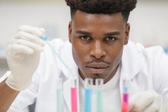 chemist in the laboratory carrying out a research experiment