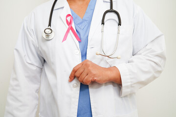 Asian woman doctor with pink ribbon, World Breast Cancer Day at October.