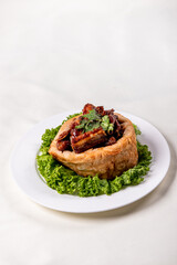 popular special wok fried sweet and sour pork ribs with deep fried yam ring on white wood table asian chinese banquet meat menu for restaurant 