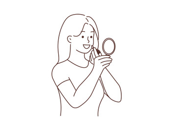 Smiling woman apply lipstick 