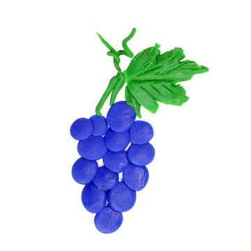 plasticine grapes isolated on white