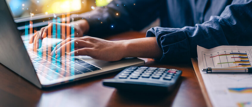 Businesswoman working with laptop, virtual reality hologram with metaverse hud, digital analysis and research,Indicators Forex and financial hologram chart. Concept of big business data.