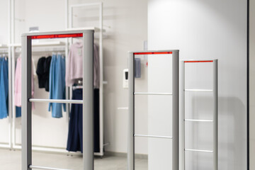 Close up anti-theft system in a clothing store. Entrance gate with scanner to prevent theft
