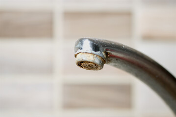 Old tap, faucet with lime deposit calcified detail, calcification of a faucet in closeup