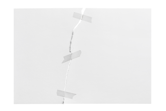 Torn sheet of paper glued with adhesive tape, cut out