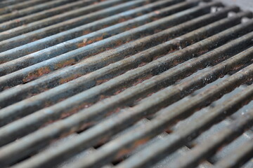 close up of a rusty bbq grill surface