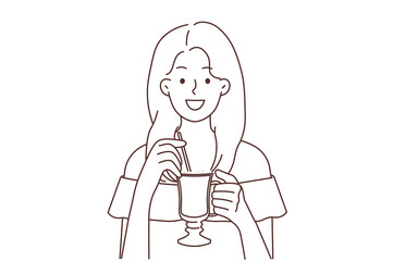 Smiling woman drinking late coffee with straw