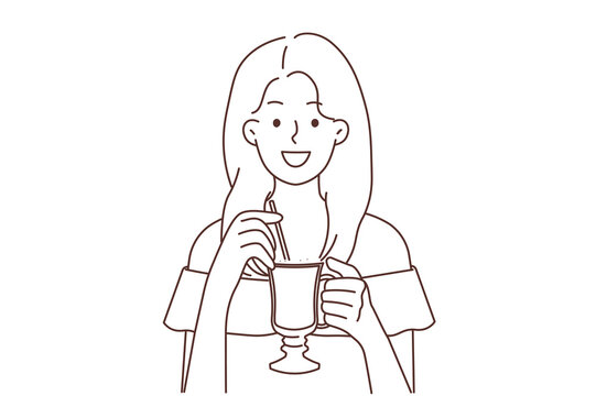 Smiling woman drinking late coffee with straw