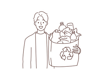 Smiling man hold plastic for recycling 