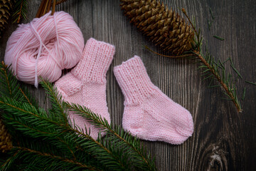 Small and soft baby socks made of pink cotton yarn 