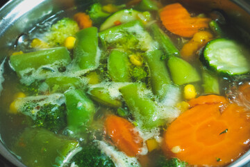Boiling vegetarian soup with vegetables. Healthy diet food.