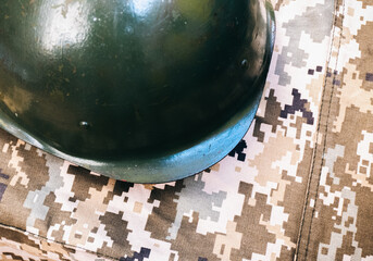 Military helmet on khaki camouflage background. Lend-Lease and Army concept. Sales of weapons and ammunition.