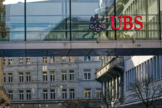 Footbridge of USB building with Credit Suisse office building in the background day after rescue deal on a sunny later winter morning. Photo taken March 20th, 2023, Zurich, Switzerland.
