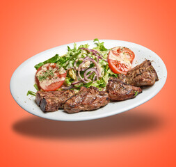 Floating White plate with lamb chops and salad