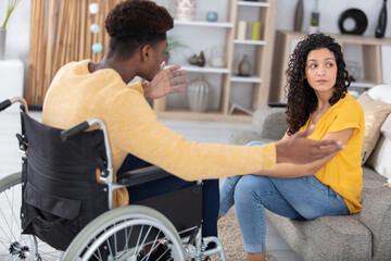 disable man and woman having argument at home