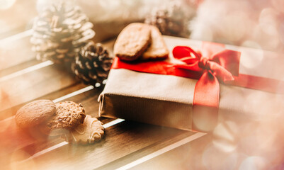 Christmas gift box with Santa Claus hat and pine cones