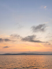 sunset over the sea with island view