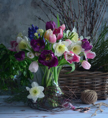 Still life flower arrangement with spring flowers in a vase. 