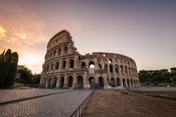 Fototapeta na wymiar Amazing view of the Colosseum at beautiful warm light at sunrise, Rome, Italy..