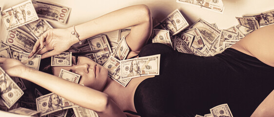 Sexy female and dollar bills. Woman with lot of money. Rich sexy woman lies on money. Currency,...