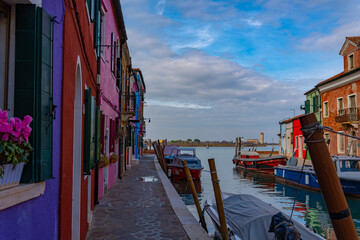 Fototapeta na wymiar Burano Italy Spring Colorful Houses Sea Boat Sun Venice