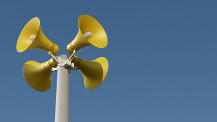 Yellow public address notification megaphones on a post against blue sky, 3d rendering. Outdoor notification loudspeakers for announcement or air raid alert