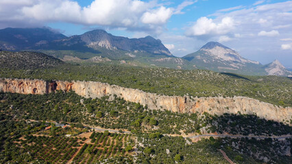 Naklejka premium The wilderness of picturesque mountains landscape on a beautiful summer day. Aerial view from drone.