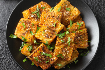 Baked accordion potato with parsley, garlic and herbs. Vegan healthy food