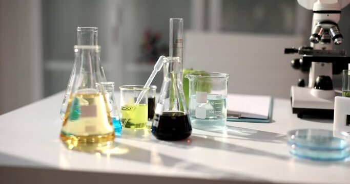 Faes with colored liquids in the laboratory, closeup, nobody