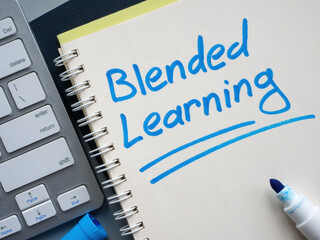 Keyboard and notebook with inscription blended learning.