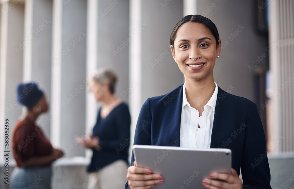 Canvas Prints My favourite get it done gadget. a young businesswoman using a digital tablet against a city background.