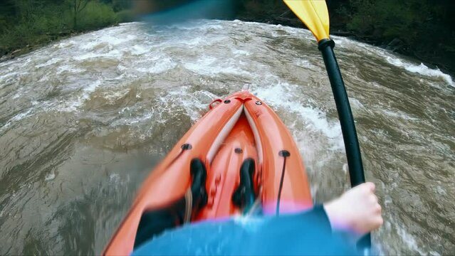 An extreme and exciting sport is rafting on the river in a kayak.