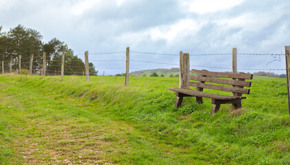 A chair on the historical pilgrims trail with german countryside landscape In Lampertstal und Alendorfer Kalktriften
