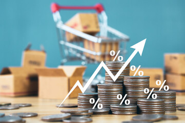Stack of silver coins with shopping basket and parcel box backgorund.financial concepts and financial investment business stock growth.Inflation, hyperinflation in the dollar.