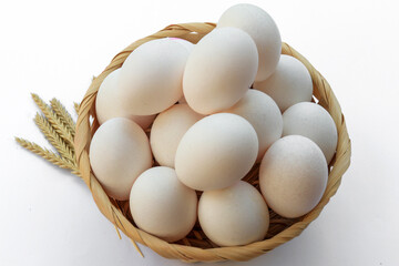 eggs in a basket on white background 