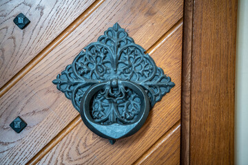 antique door handle cast from metal according to ancient technologies