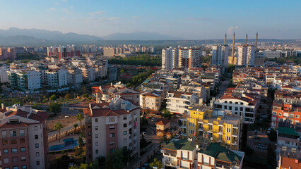 Aerial view of urban landscape with view of multi-storey colored houses. City buildings from above.