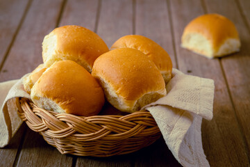 Soft bread rolls in wicker basket
