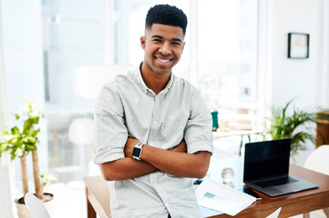 Self confidence fuels success. Portrait of a confident young businessman working in a modern office.