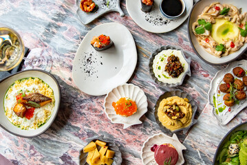 variety of restaurant food dishes on table