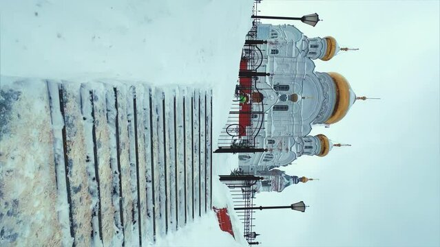 Belogorsky St. Nicholas Orthodox Missionary Monastery. Russia, Perm Krai, Belaya Gora. The temple on the hill in winter. Monastery on the background of snow. 4K
